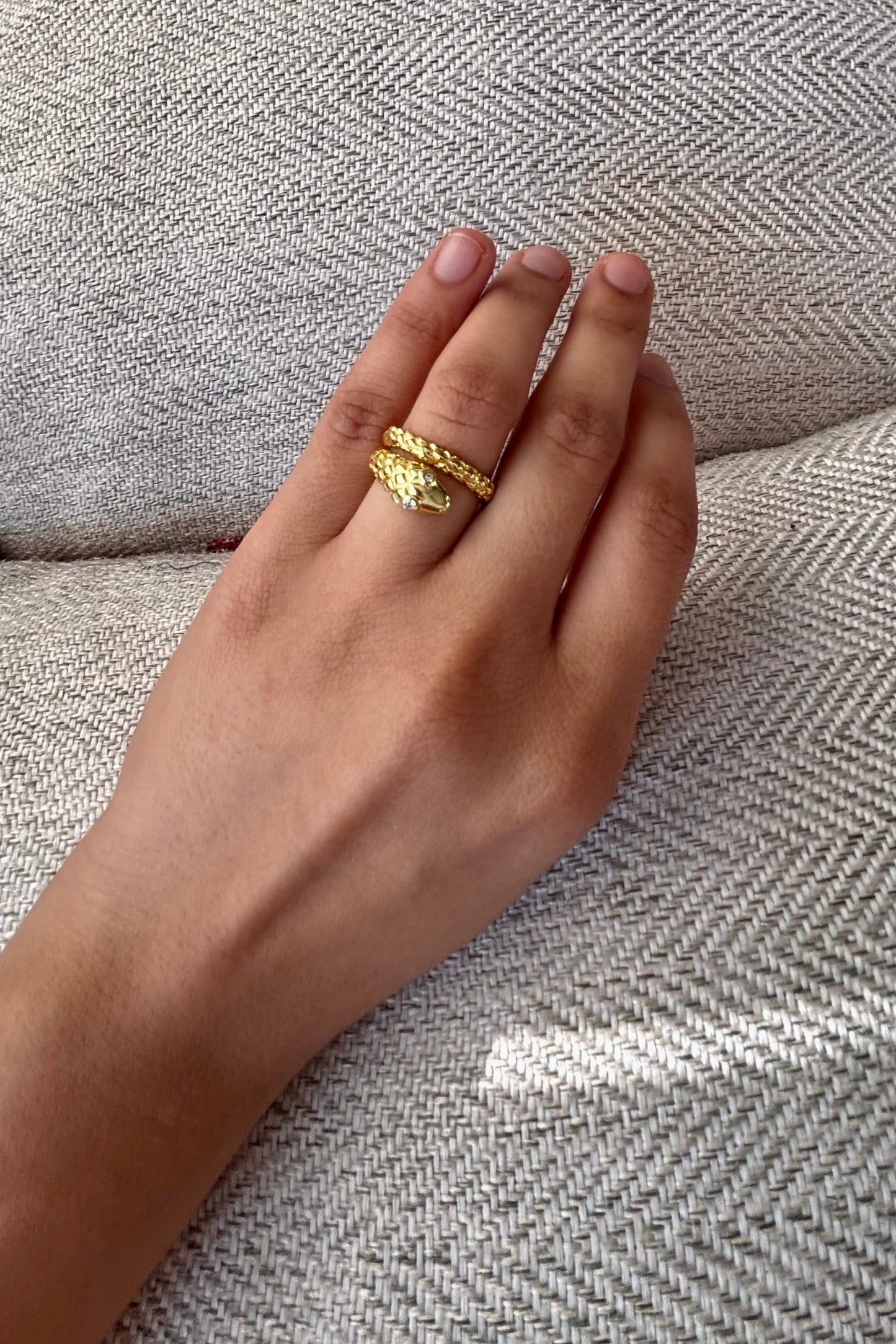 Coiled serpent ring that wraps around your finger like modern armor baari jwellery shopbaari